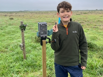 Volunteer Henry Day checking equipment at the Speechly's Farm monitoring station