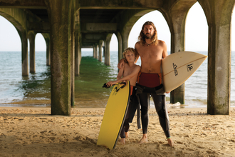 Father and son with surf boards