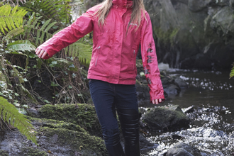 Molly stands in a stream