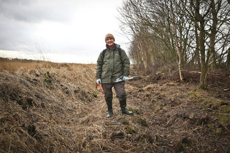 Tim standing in ditch