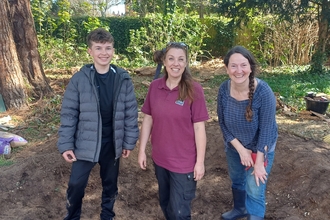 Alison with volunteers in the pond hole