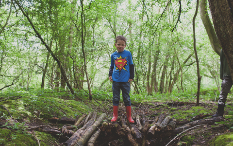 Edward stands on a pile of branches