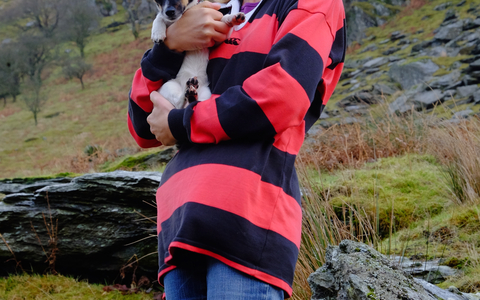 Emma with her dog in the hills