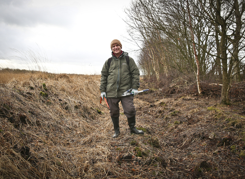 Tim standing in ditch